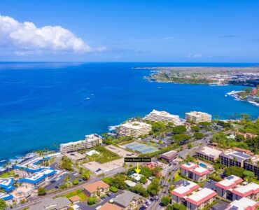 This aerial view shows the Kona Beach Hostel in the foreground looking south.