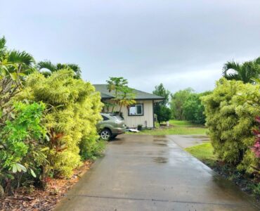 Lush landscaping, level lot with views to the shoreline