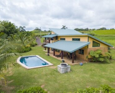 There is a fire pit to the right of the pool for cooler evenings and gatherings.