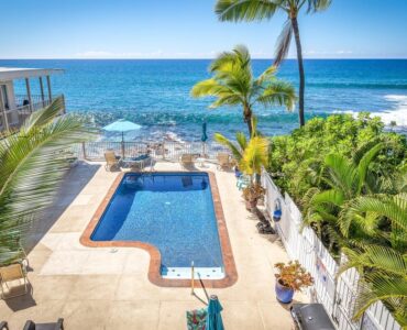 Inviting view of the pool and the Blue Pacific ocean from the lanai.