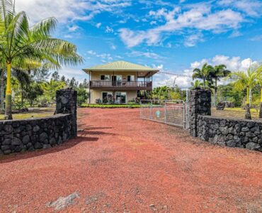 Impressive rock wall entry and electric (solar) gate.